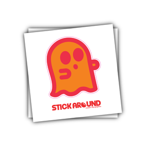 A square sticker features a simplistic orange ghost with pink outlines, eyes, and wavy base edges against a white background. Below the ghost, in red text, it reads "STICK AROUND" followed by "custom vinyl stickers" in smaller text. Perfect for promoting your brand or labeling your items!
